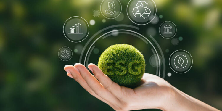Hand of human holding green earth ESG icon for Environment Social and Governance, World sustainable environment concept.