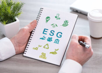 Hand holding a notepad with esg concept