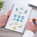 Hand holding a notepad with esg concept