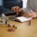 closeup-shot-person-thinking-buying-selling-house 1 - Pratama Institute Pemerintah Tegaskan Pemda Tak Boleh Sembarangan Naikkan PBB