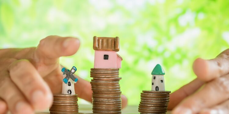 hand-pampered-coins-small-house-model 1 - Pratama Institute Apakah SROI Bisa Menjadi Kompas Baru dalam Kebijakan Fiskal Indonesia?