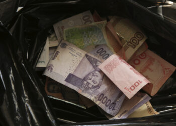 Ilustreasi rupiah yang melemah